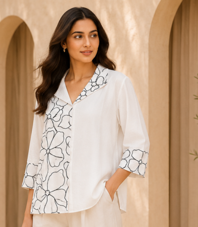 White Women’s Top with Navy Blue Floral Embroidery